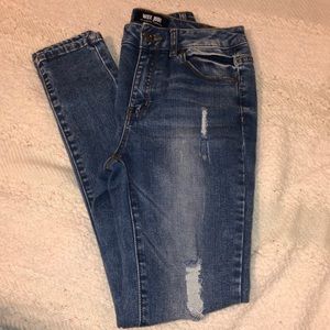 Distressed light wash skinny jeans